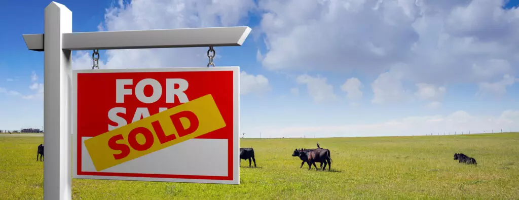 Ranch pasture with for sale sign